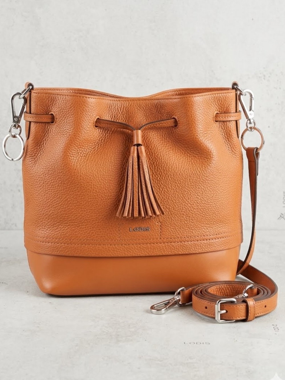 Lodis Cognac Leather Tassel Drawstring Shoulder Bag - wardrobe staple